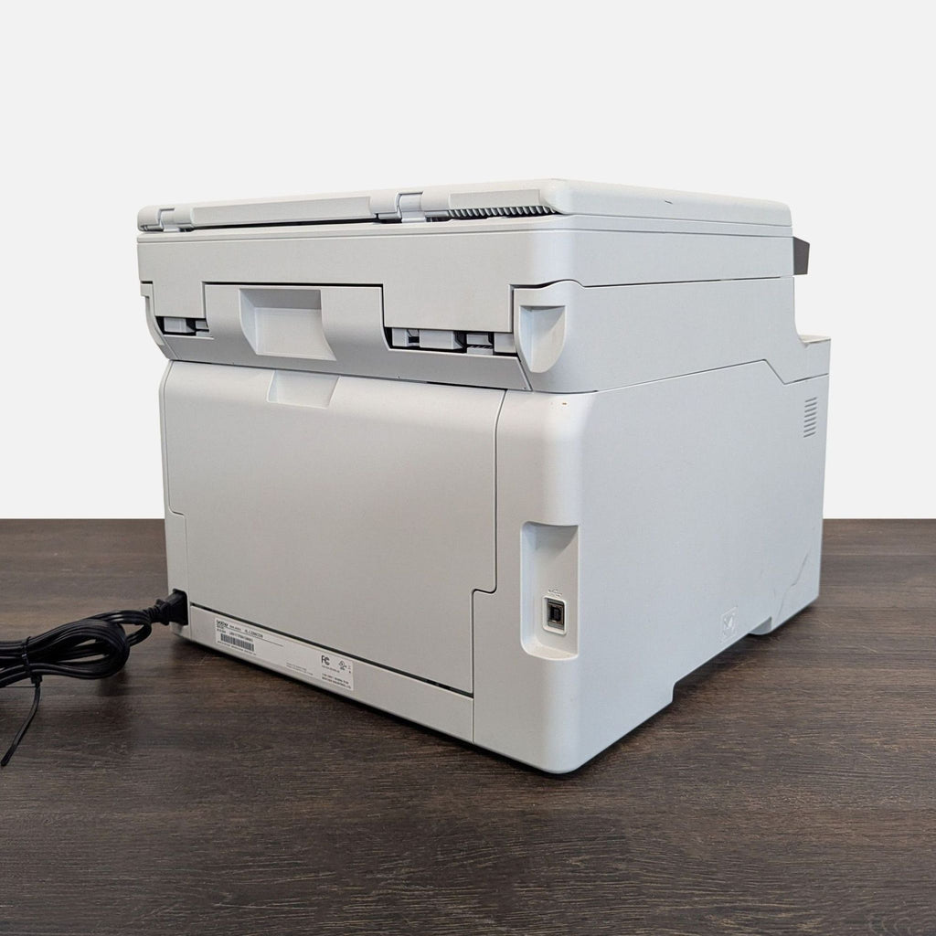 Brother printer for color printing, scanning, and copying; USB connection; compact design with slight wear visible.  