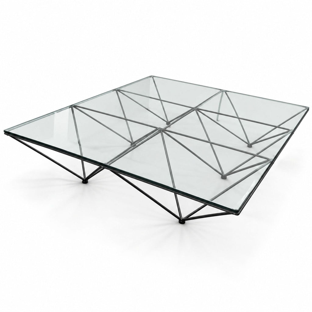 A reissued Alanda coffee table in black painted steel with bold pyramid-inspired structure by architect Paolo Piva.