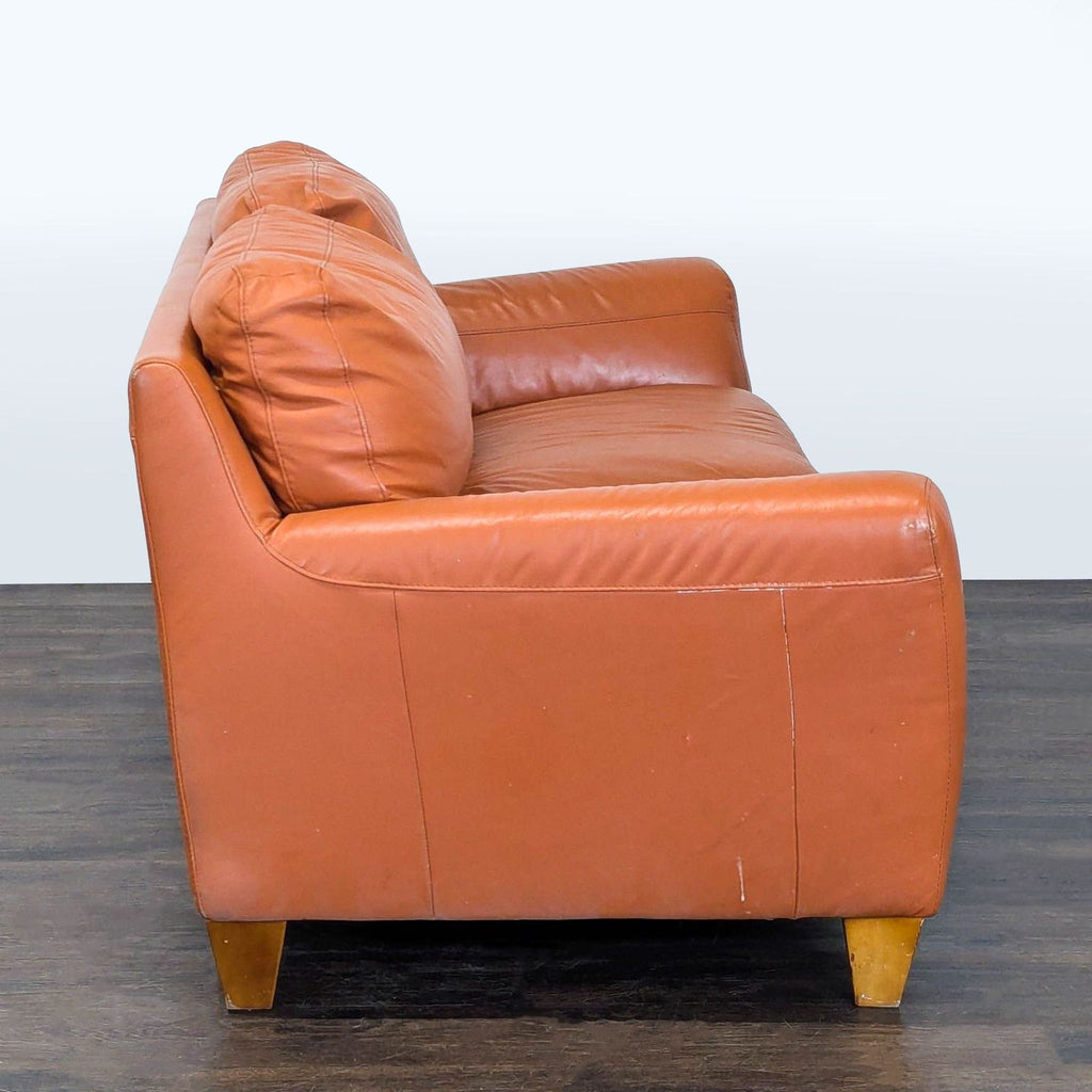 Contemporary Italsofa loveseat with plush cushions and sleek armrests, shown in a modern room.