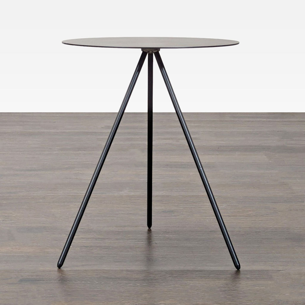 Modern EQ3 end table featuring a sheet metal top and a sleek stainless steel base.  