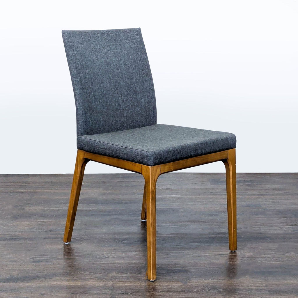 Contemporary New Pacific Direct dining chair featuring cushioned upholstery and a sturdy wooden base.  