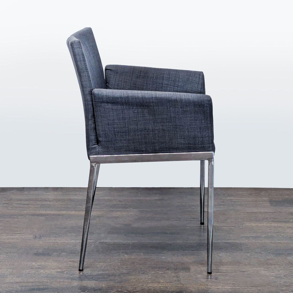 2. Set of four dining chairs with minimalist design, arranged around a dining table.