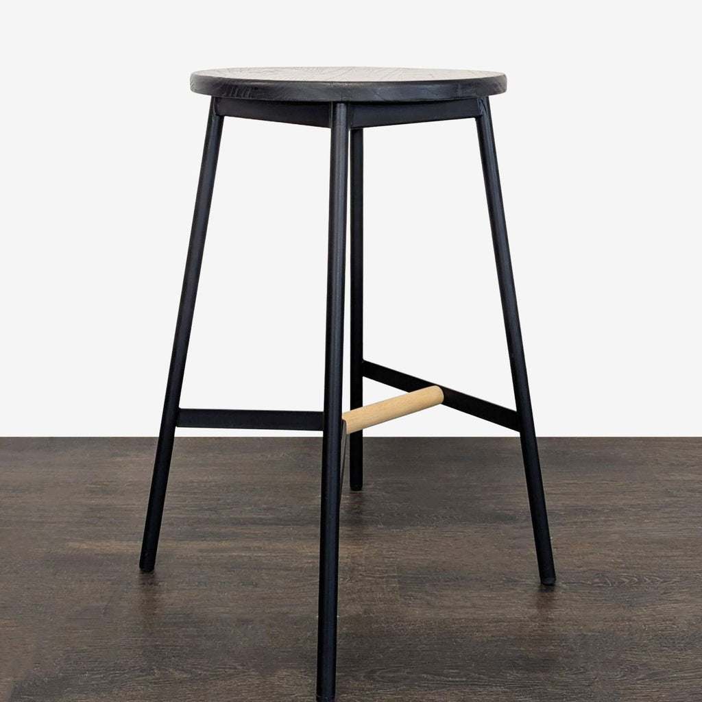 Sleek black stool with wood details, perfect as extra seating in workspaces, kitchens, or as a stylish accent.