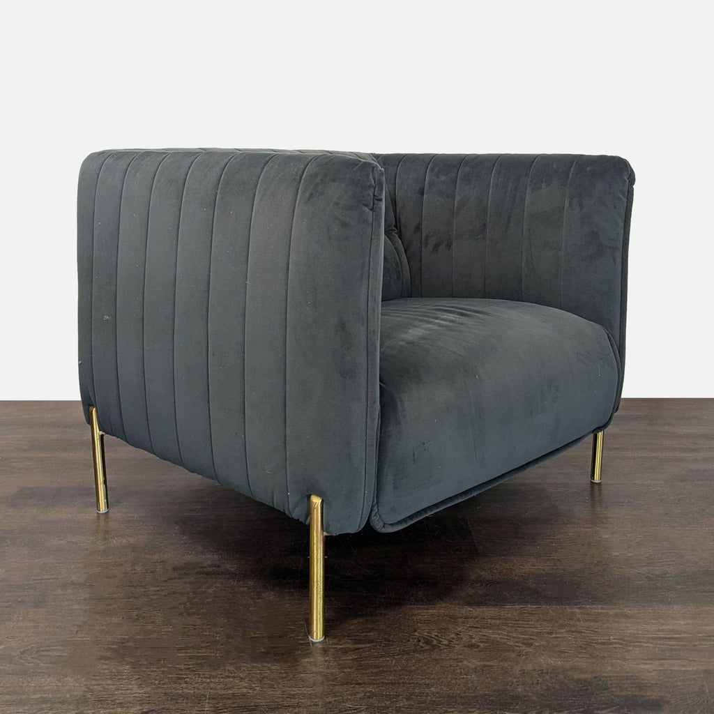 Chic lounge chair in soft velvet fabric featuring vertical stitching and sleek gold legs for a stylish look.