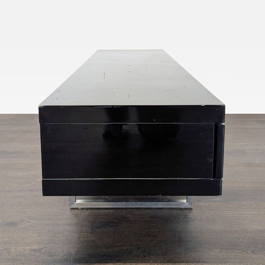 Contemporary entertainment center featuring clean lines, spacious storage drawers, open shelf, and hidden cable management.