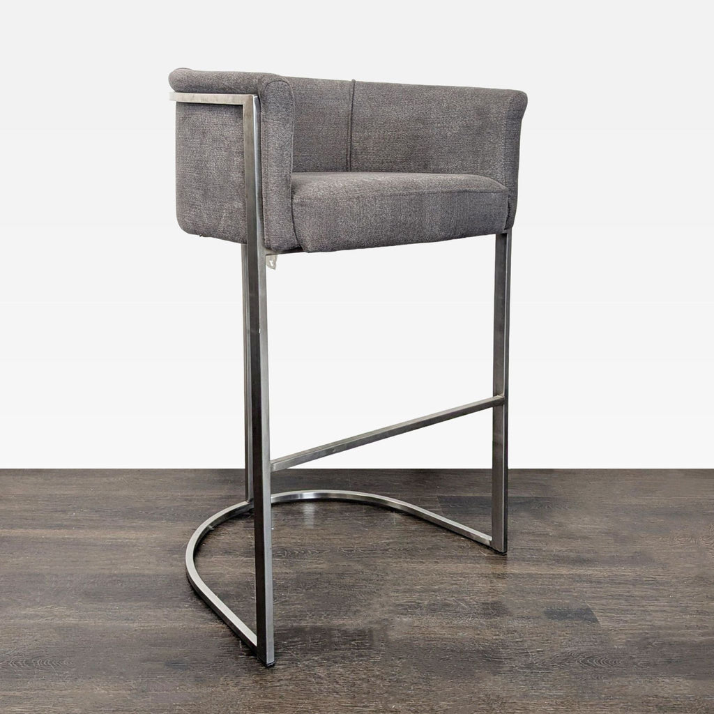 Modern counter stool by Euro Style featuring a comfortable grey seat and sturdy metal legs for stylish seating.  