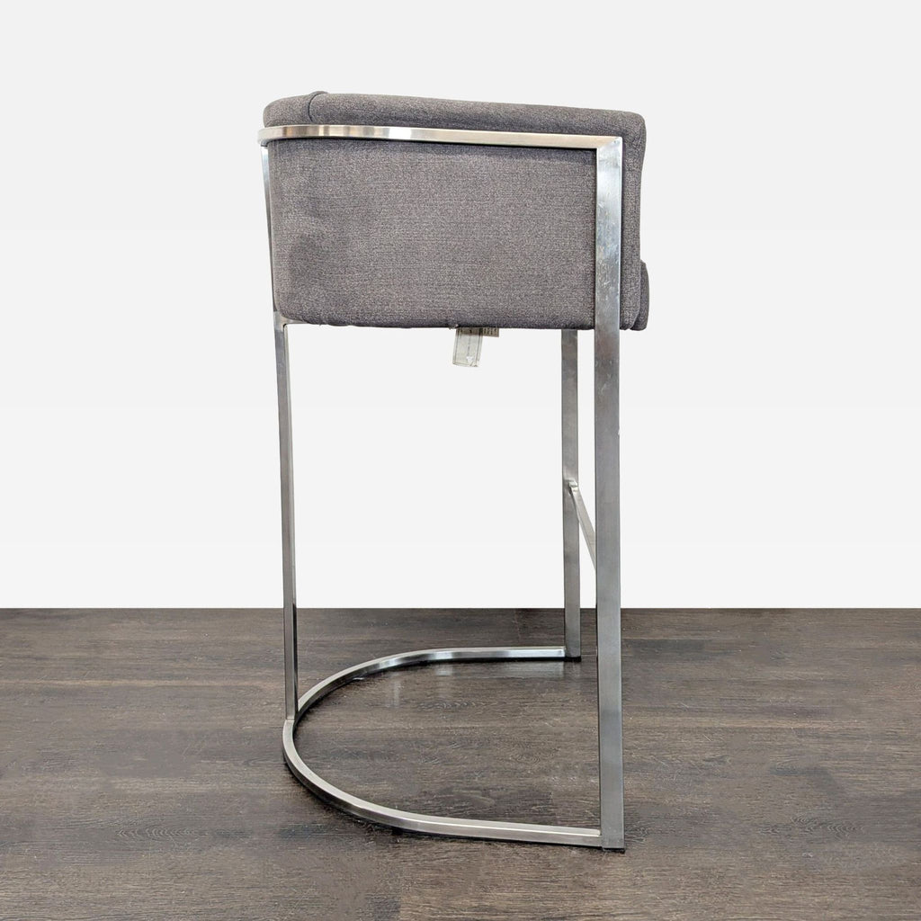 Euro Style stool with soft grey cushioning and metallic base, perfect for various décor settings and daily use.