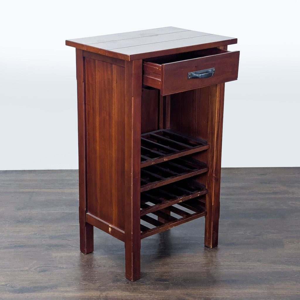 Rectangular wooden wine cabinet featuring a metal-handled drawer, glass rack, and four horizontal bottle shelves.