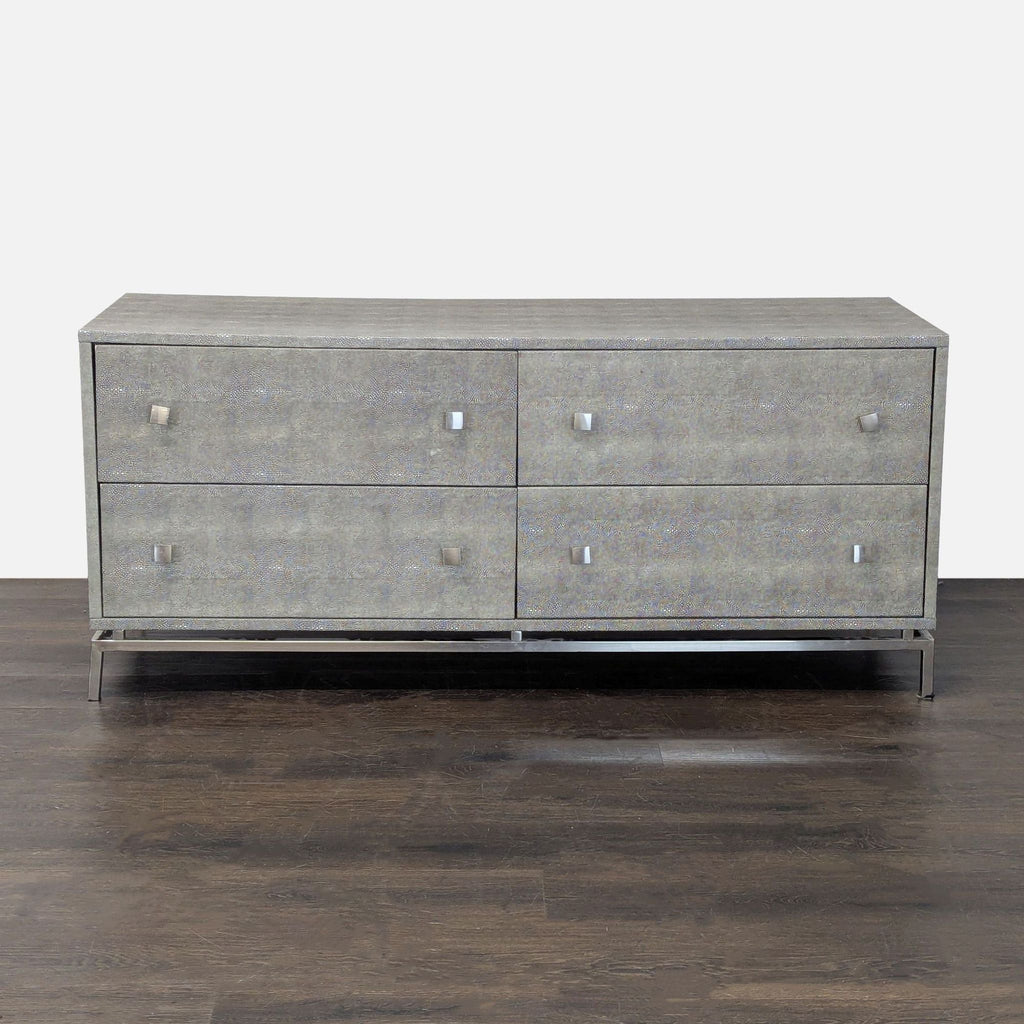 CB2 dresser with a grey finish, modern metal base, and four drawers for sleek, practical storage.