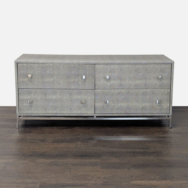 CB2 grey dresser with four drawers and metal legs, featuring a sleek modern design and spacious storage.