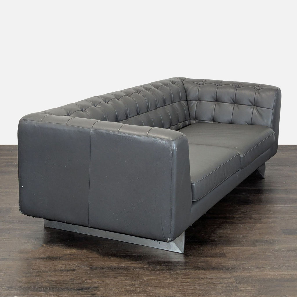 Contemporary dark gray leather 3-seater sofa by Jason Furniture featuring tufted details and sleek design.