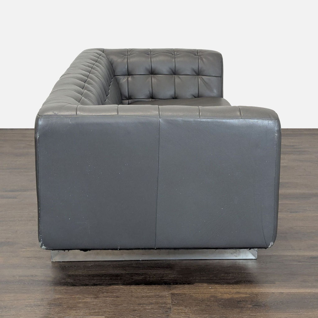 Modern 3-seat sofa by Jason Furniture, upholstered in dark gray leather with tufted back and sides.