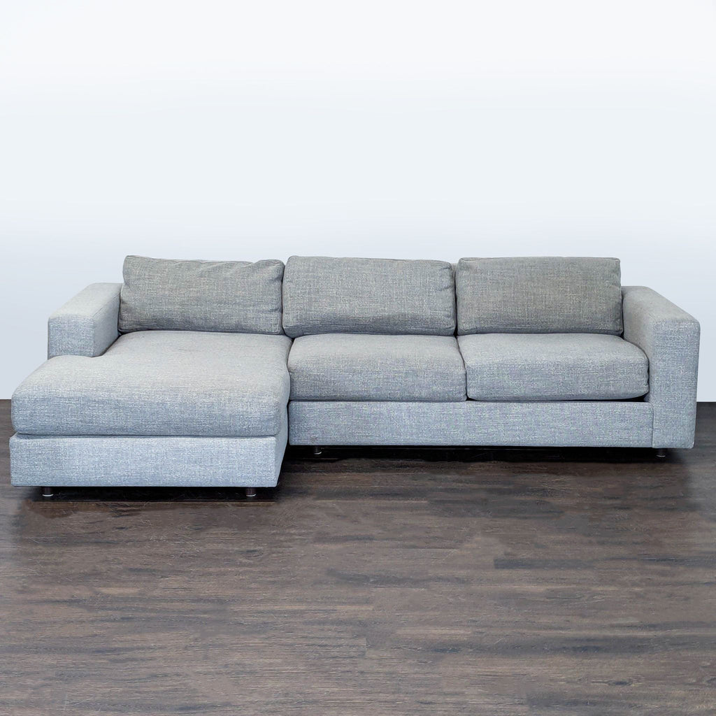 West Elm gray sectional with left-facing chaise, thick cushions, and wide armrests for modern living rooms.  