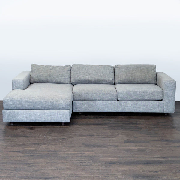 West Elm gray sectional with left-facing chaise, thick cushions, and wide armrests for modern living rooms.  