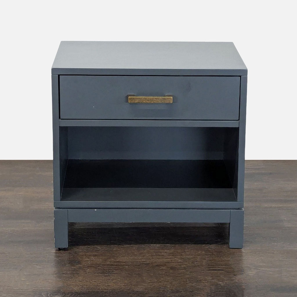 1. The Land of Nod end table with one drawer, open shelf, and metal hardware.