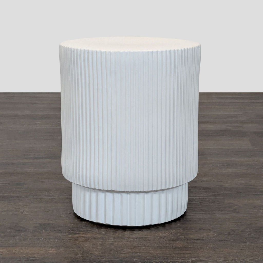 1. Hand-molded earthenware side table by West Elm with a semi-matte glaze, suitable for indoor or outdoor use.  