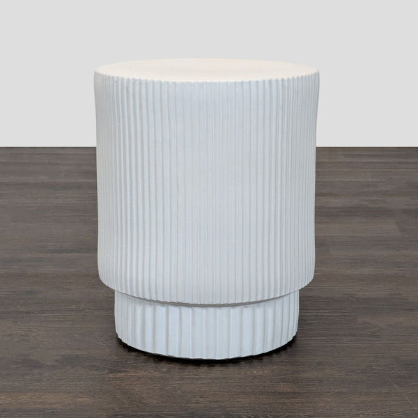 1. Hand-molded earthenware side table by West Elm with a semi-matte glaze, suitable for indoor or outdoor use.  