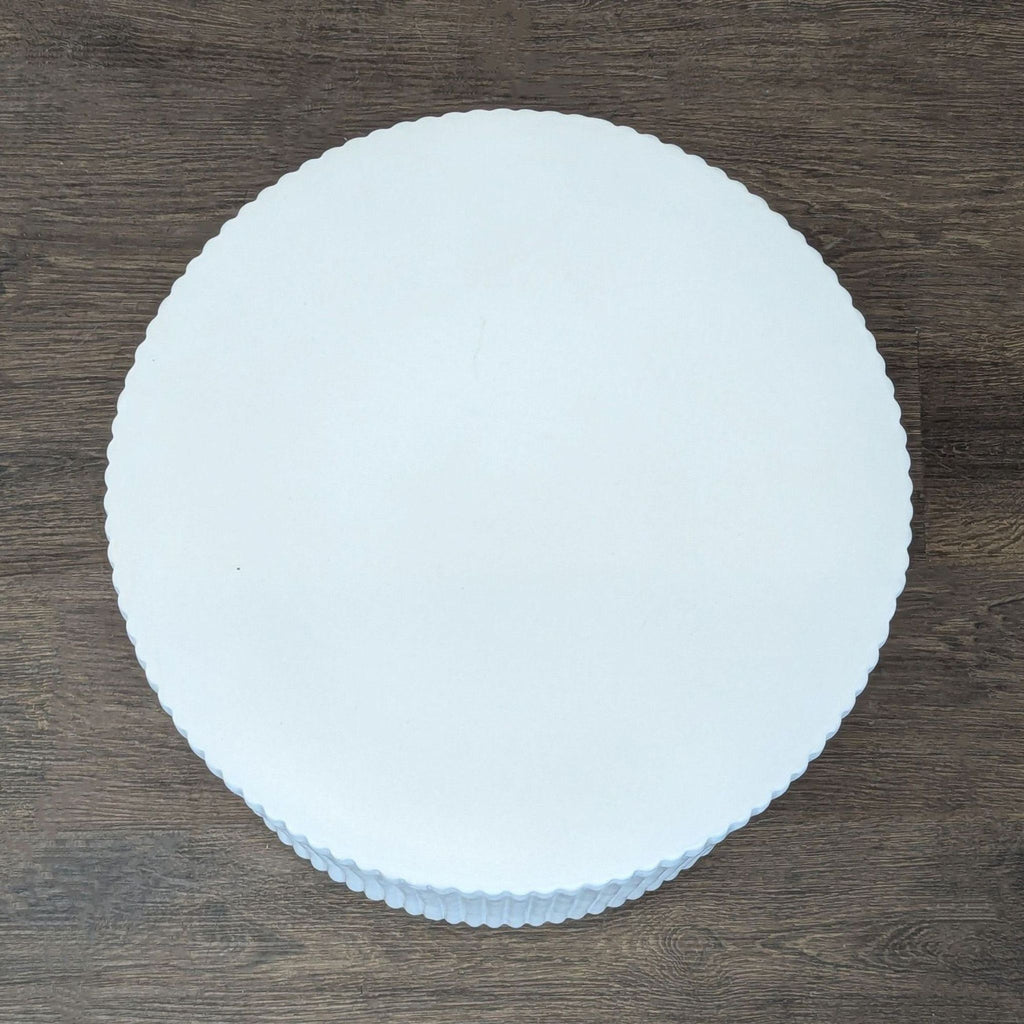 3. Semi-matte glazed earthenware table from West Elm, designed as a side or console table for indoor/outdoor settings.