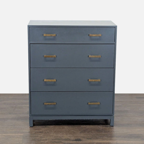 Sleek The Land of Nod dresser with four roomy drawers and brass handles, ideal for modern bedrooms.