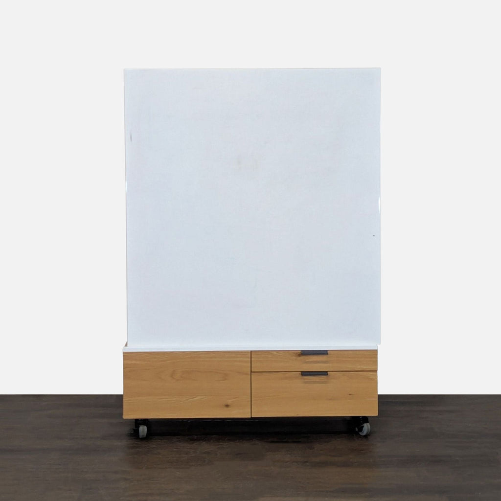 Whiteboard on wheels, featuring four-drawer wooden storage base, perfect for meetings and office presentations.