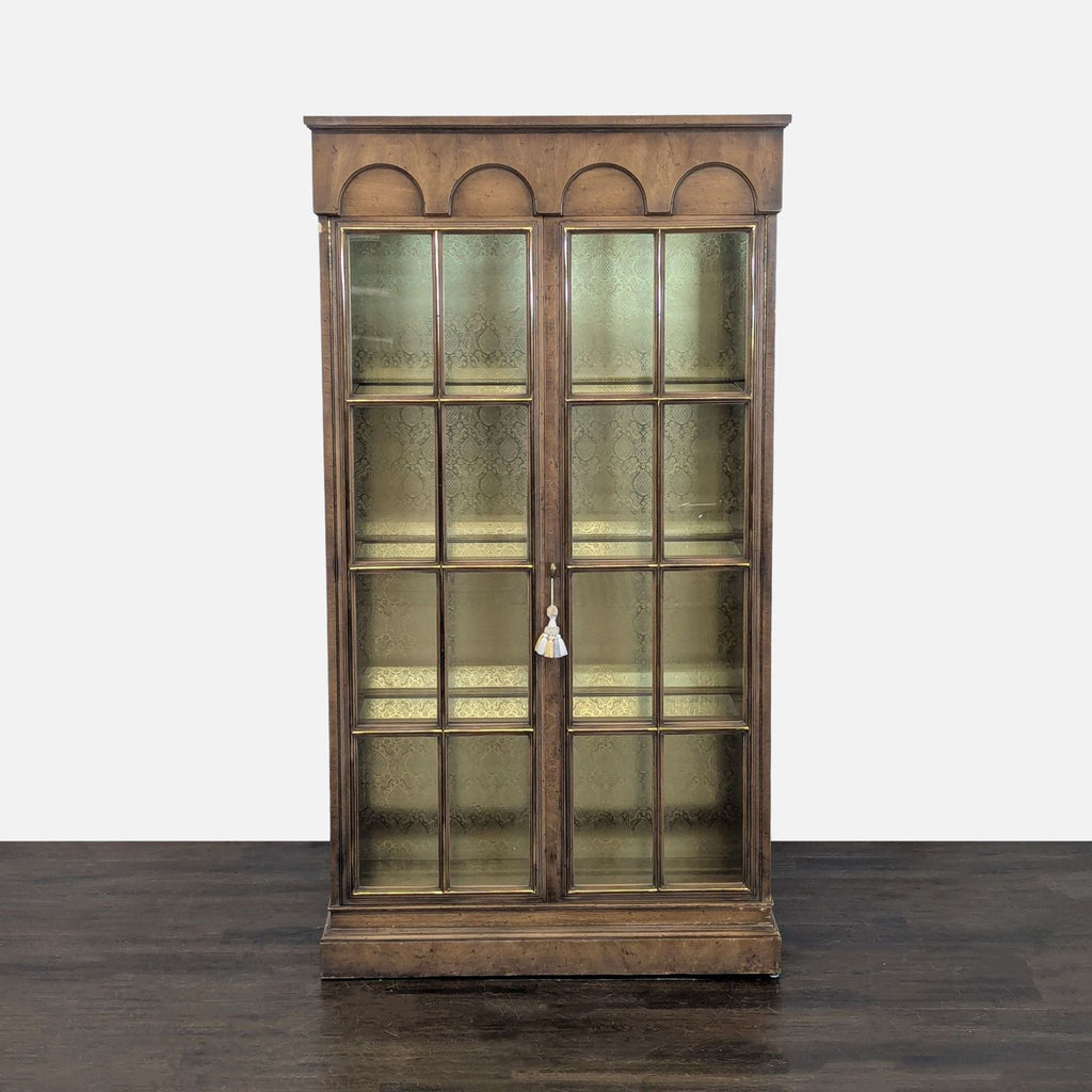 Glass-doored cabinet with grid design, three shelves, and a patterned-backed, illuminated interior.