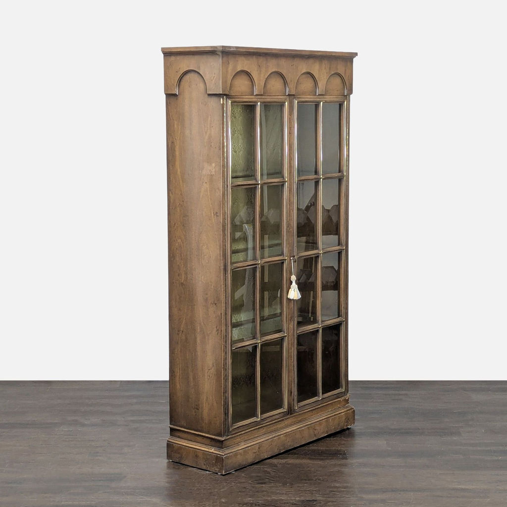 Electrified cabinet in classic style, showing a grid pattern on glass doors and patterned interior backing.