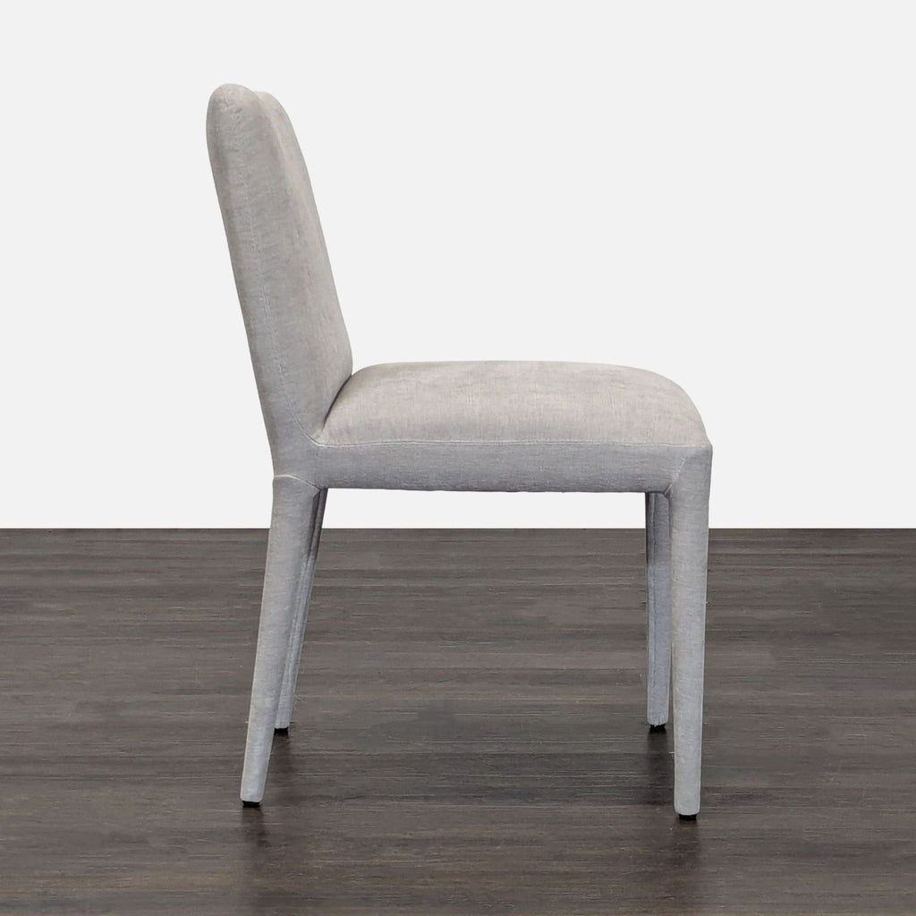 Contemporary dining chair from Moe's Home Collection with a minimalist silhouette and upholstered seat.