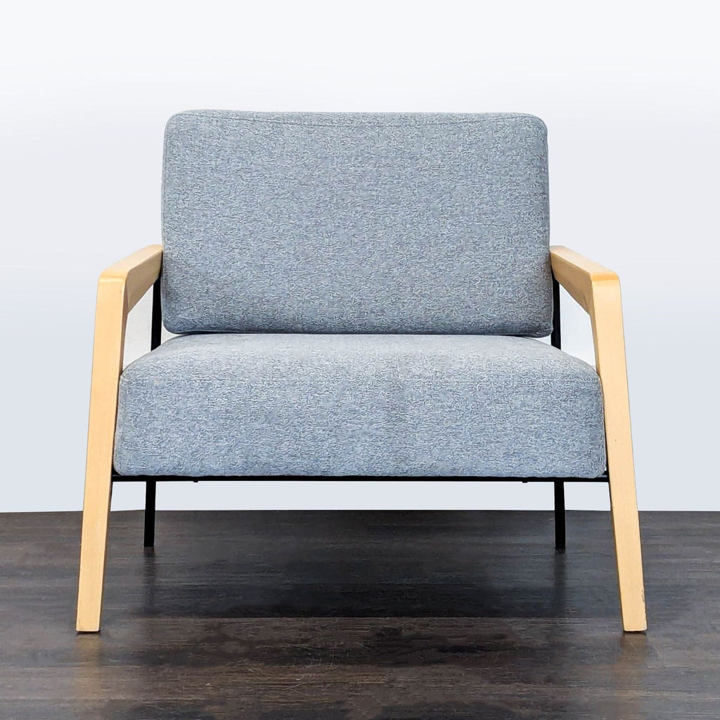 Kimball International lounge chair with blue-gray fabric, light wood arms, and cushioned support in modern style.