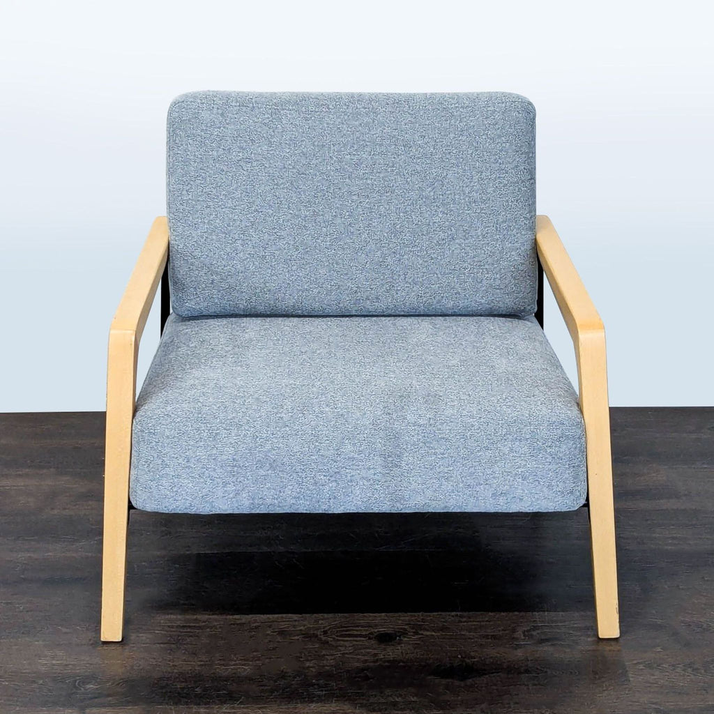 Modern Kimball International lounge chair with soft upholstery, sturdy wooden accents, and simple, stylish lines.