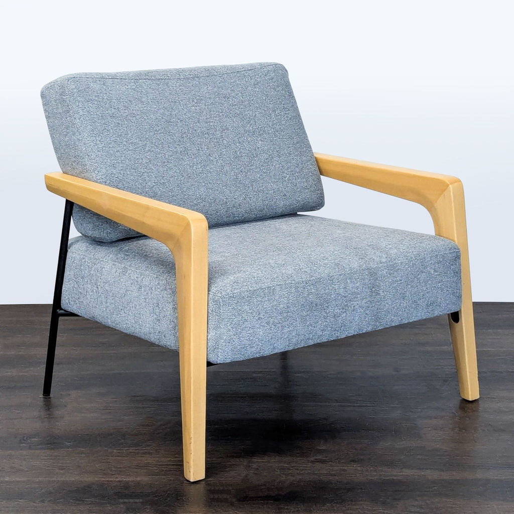 Blue-gray fabric lounge chair by Kimball International, featuring solid wood arms and a comfortable, cushioned seat.