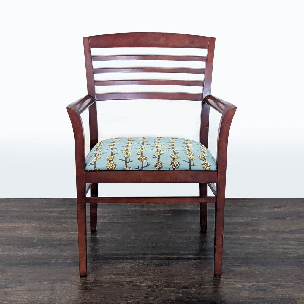 1. Front view of a National brand wooden chair with a slatted back and blue floral-patterned upholstered seat.