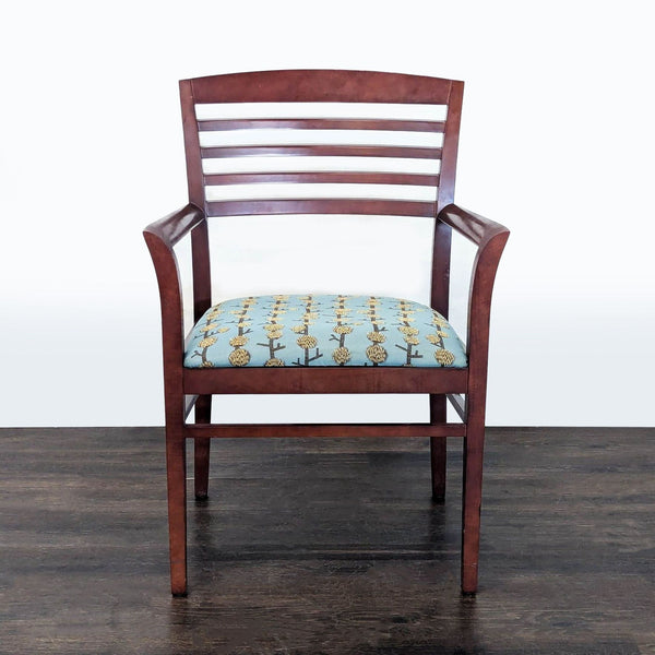 1. Front view of a National brand wooden chair with a slatted back and blue floral-patterned upholstered seat.