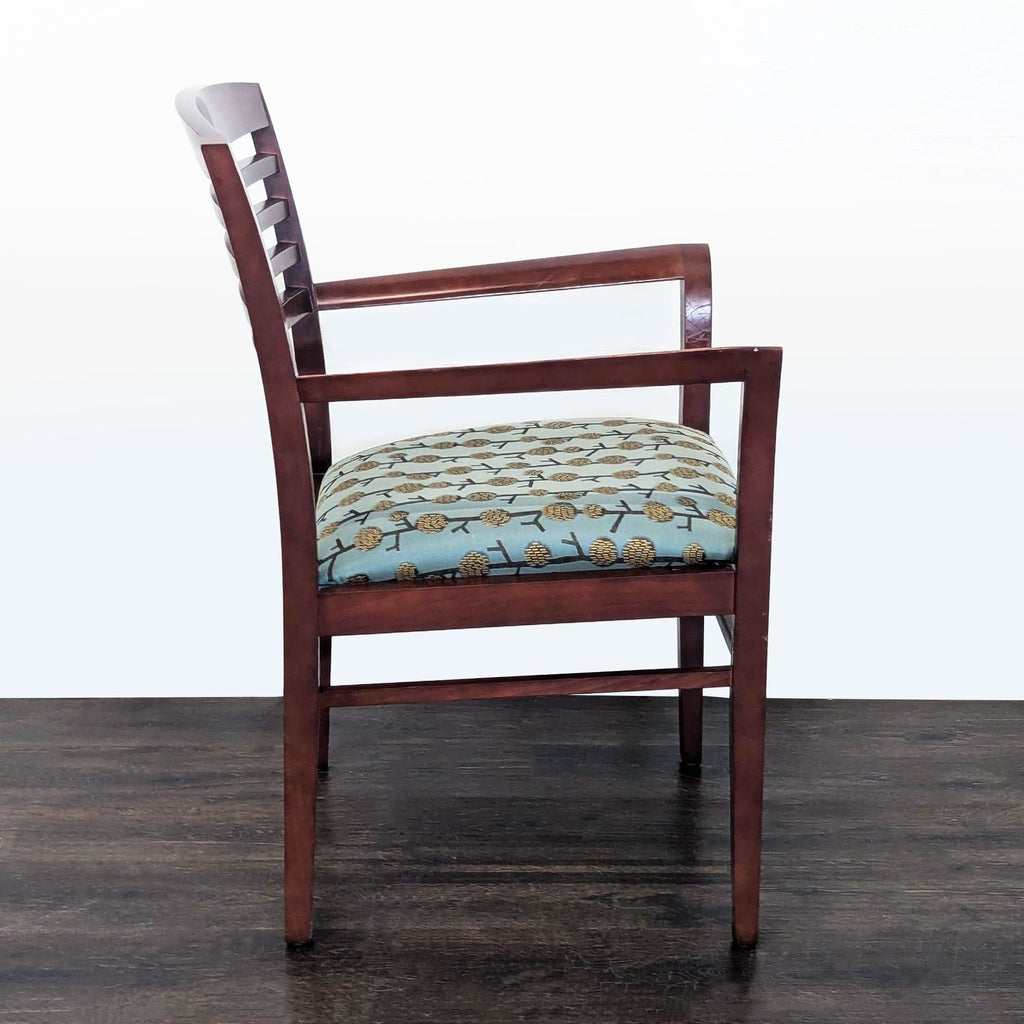 3. Side profile of a National brand wooden armchair, showcasing its patterned blue seat and ladder-style backrest.