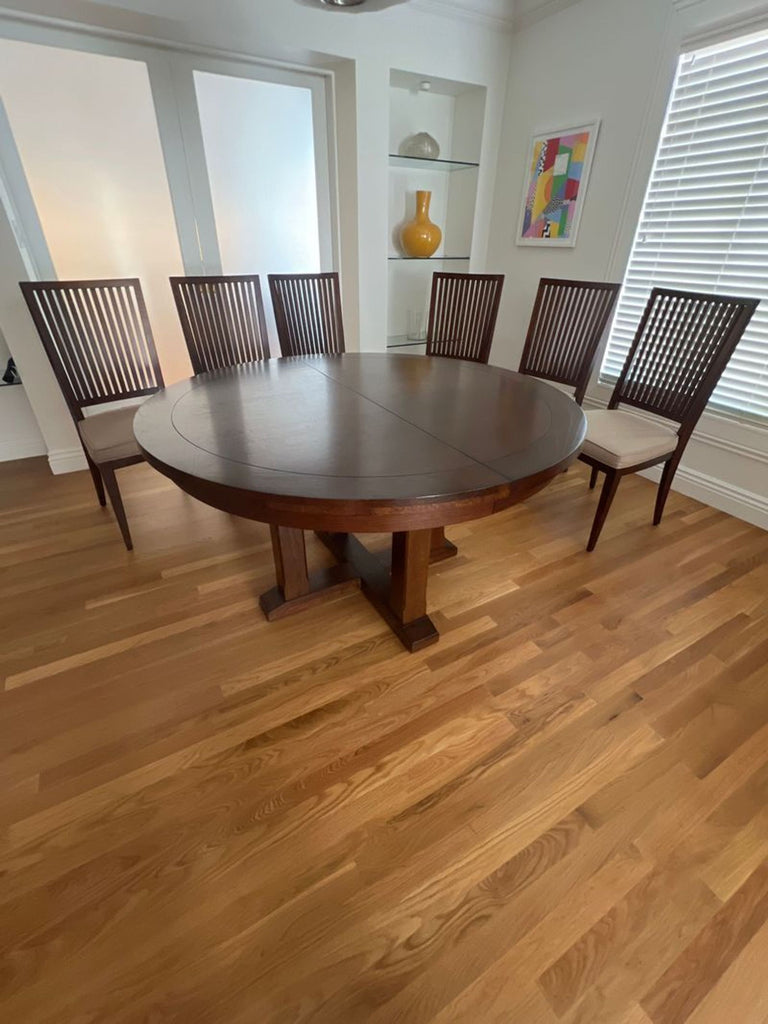 1. Modern Pottery Barn dining set featuring a wooden table and upholstered chairs in a bright dining room.