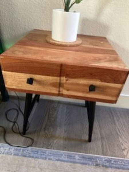 1. Reperch end table with two-tone wood finish, black legs, and two drawers, shown with a white plant pot.