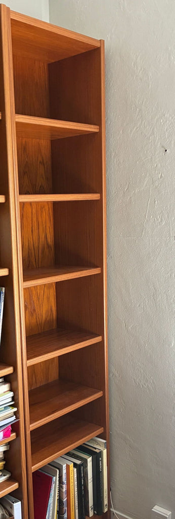 1. Tall wooden bookshelf with five shelves, minimalist Scandinavian style, by Scandinavian Designs.