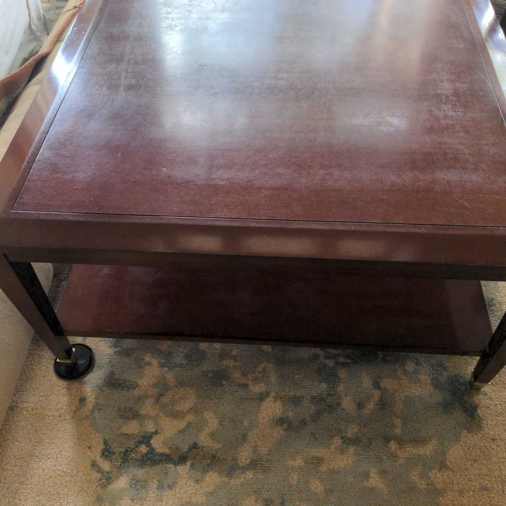 Dark brown Reperch coffee table with a lower shelf, shown on a patterned rug, rectangular shape.