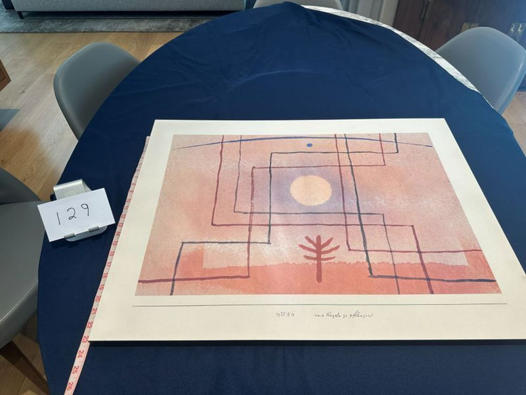 3. Artistic print in pink and purple hues with a sun, tree, and measuring tape, displayed as map or print.
