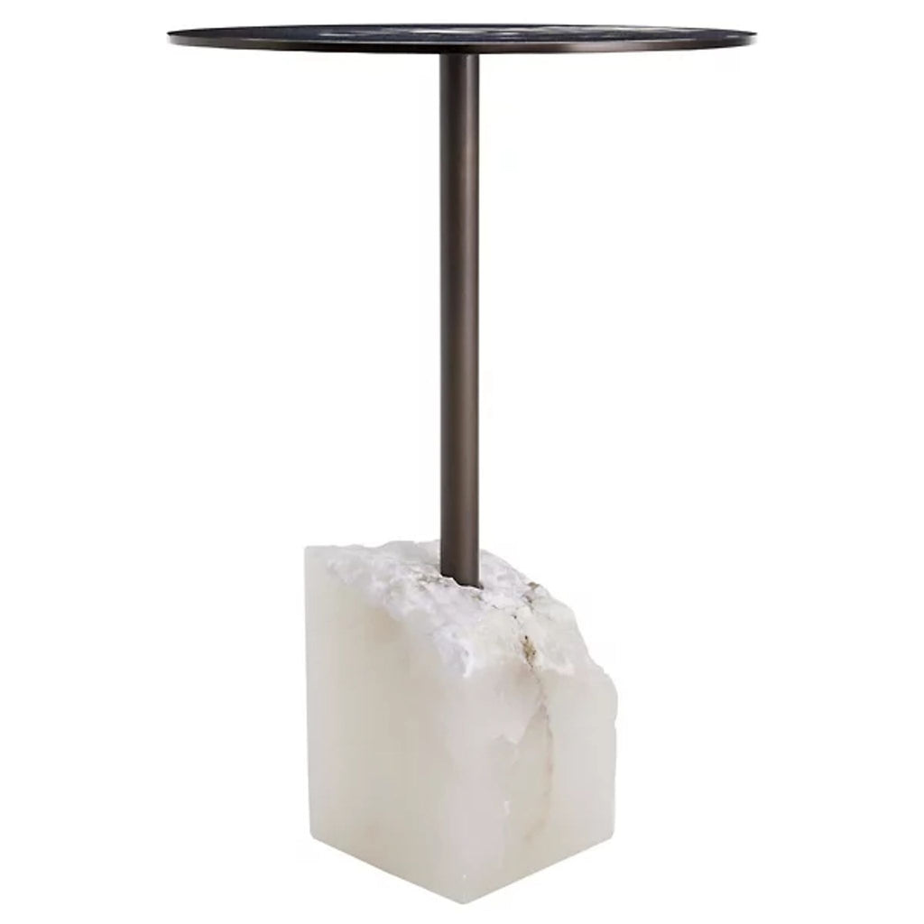 2. Modern side table by Reperch with a circular dark surface and raw crystal-like stone base.  
