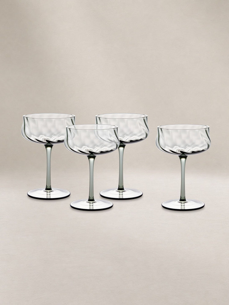 Certainly! However, I don't see any images or specific details about the item besides its category, "Glassware." Here are three distinct, general-purpose alt texts for an unspecified glassware image. If you provide an image or more details, I can tailor the alt text further.