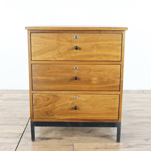 1. Walnut three-drawer dresser on a steel base from Room & Board, shown on a wooden floor.  