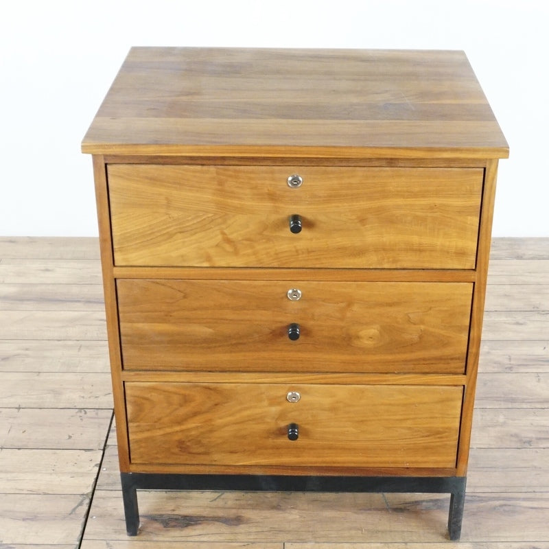 2. Top-down view of a Room & Board walnut dresser with three drawers and a steel base.  