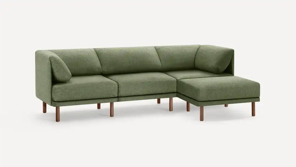 a couch with a green couch cushion on it 