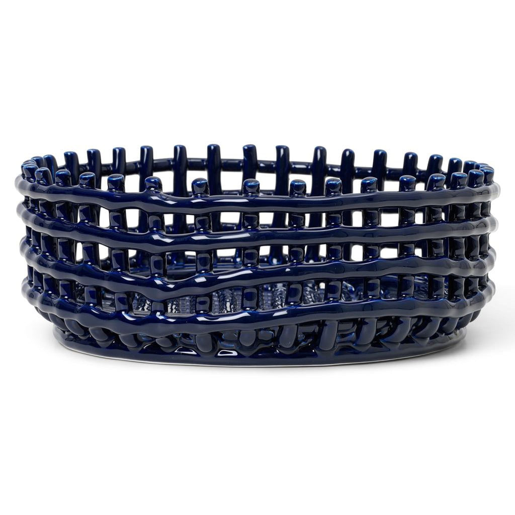 Dark blue ceramic centerpiece with a woven basket design, perfect for serving fruit or bread.