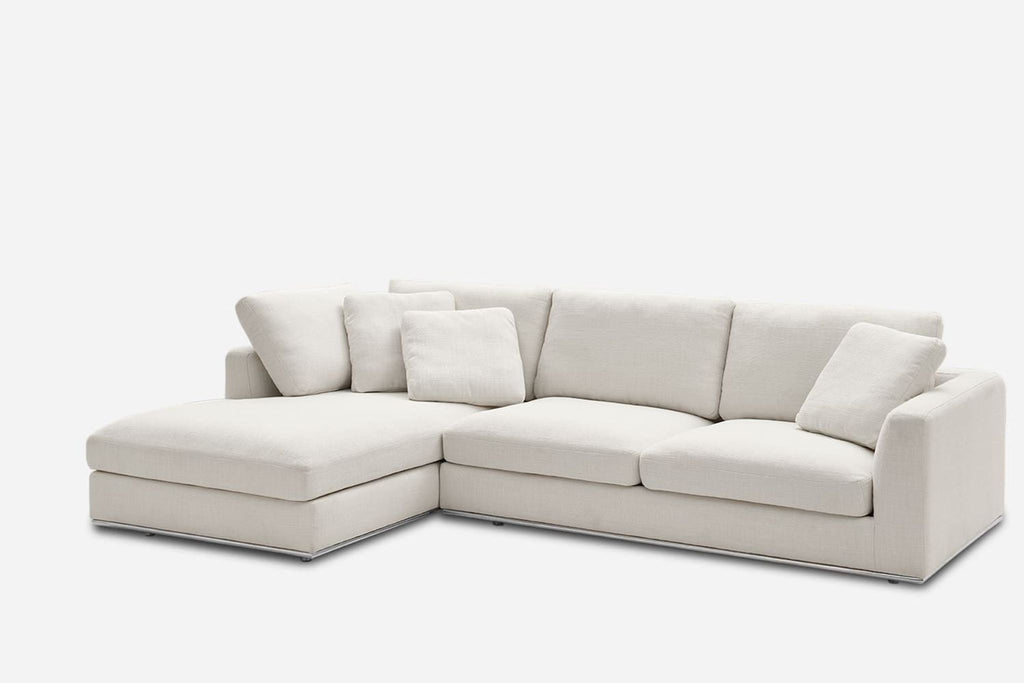 2. Angled view of the Reperch sectional in cream fabric, featuring plush cushions and left-facing chaise.
