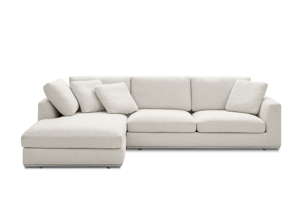 1. Front view of a Reperch sectional sofa in light fabric with chaise lounge and matching cushions.