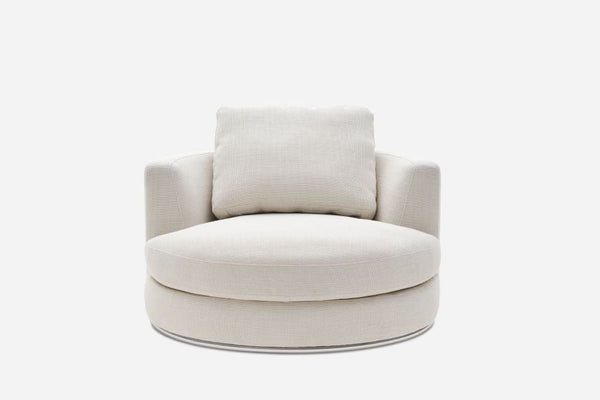 a round, white chair with a round back and a gray cushion.