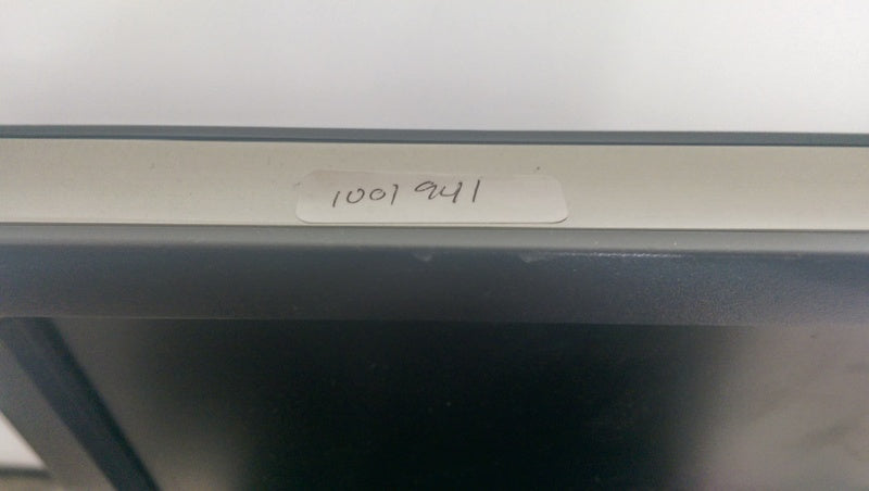 2. Close-up of the top edge of a Dell monitor showing a label with handwritten number "1001941".