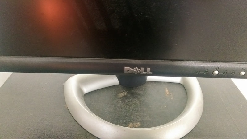 3. The lower front of a Dell monitor, highlighting the Dell logo, buttons, and a silver rounded base.