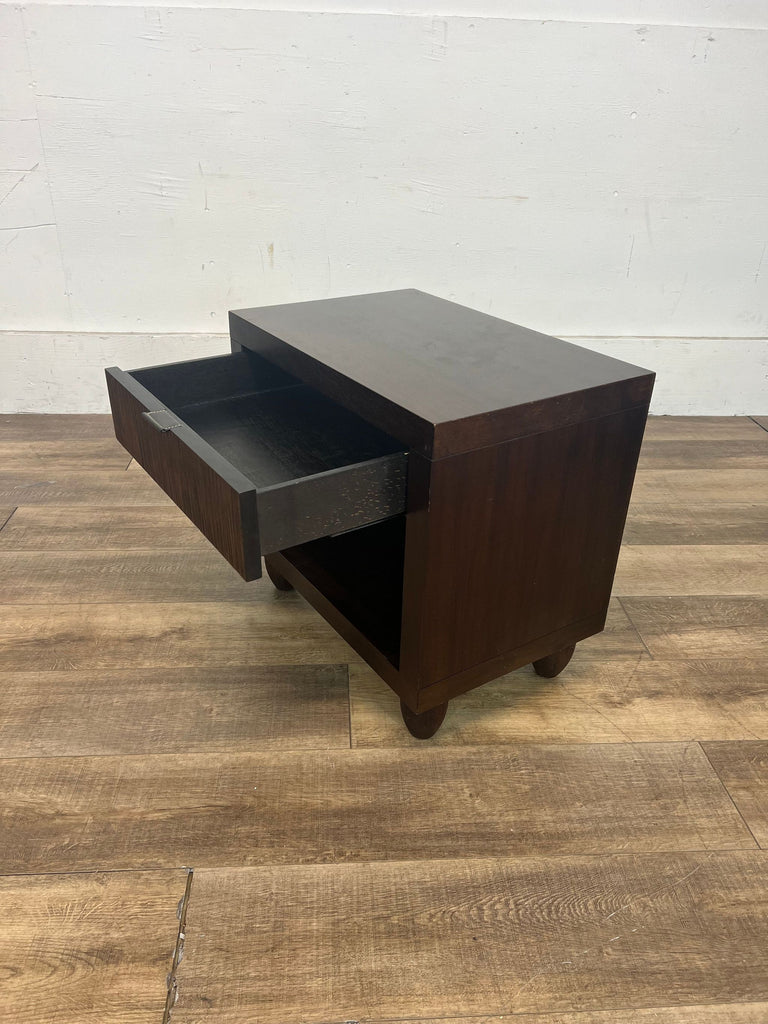 3. Angled view of a dark brown Reperch end table with the drawer fully extended, showcasing interior storage space, positioned on a wooden floor.